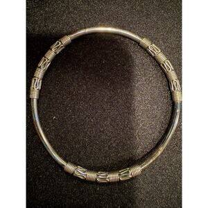 Vintage sterling silver tube bangle bracelet with wire-wrapped swirl details